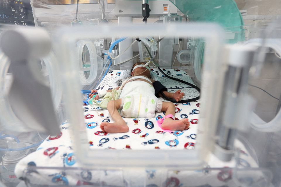 A premature baby lies in an incubator in Al-Shifa Hospital in Gaza City on October 22. Thirty-one premature babies from Al-Shifa were eventually evacuated to Egypt. Photo: Reuters/Mohammed Al-Masri